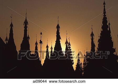 Myanmar (Burma), Yangon, Shwedagon Paya, Silhouette of stupa tops at sunset. View Large Photo Image Picture - Myanmar (Burma), Yangon, Shwedagon Paya, Silhouette of stupa tops at sunset.. Fotosearch