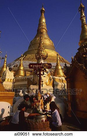 Myanmar (Burma), Yangon, Shwedagon Paya, Worshippers at Washing Buddha image at planetary post. View Large Photo Image Stock Image - Myanmar (Burma), Yangon, Shwedagon Paya, Worshippers at Washing Buddha image at planetary post.. Fotosearch