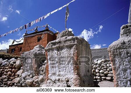 Stock Photo - Nepal, Mustang, Main monastery in Lo Manthang, chortens in foreground.. Fotosearch