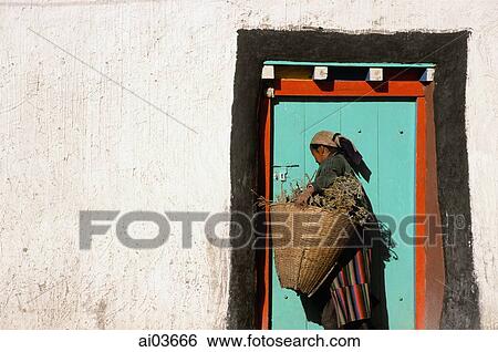 Nepal, Mustang, Woman at painted door View Large Photo Image Stock Photograph - Nepal, Mustang, Woman at painted door. Fotosearch