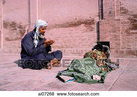 Pakistan, man praying for the dead View Large Photo Image Stock Photo - Pakistan, man praying for the dead. Fotosearch