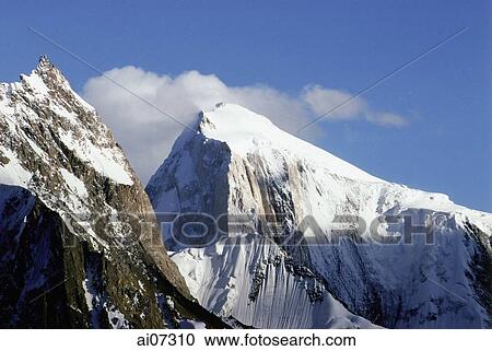 Stock Image - Pakistan, Northern Areas, Hunza Valley, Golden Peak in the day.. Fotosearch