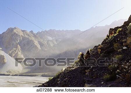 Pakistan, Northern Areas, Hunza Valley, Villagers walking on trail. View Large Photo Image Stock Photo - Pakistan, Northern Areas, Hunza Valley, Villagers walking on trail.. Fotosearch