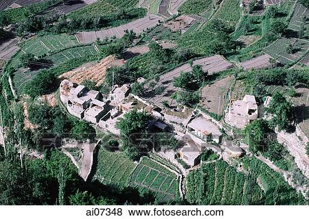 Stock Photo - Pakistan, Northern Areas, Hunza Valley, Altit, Aerial view of village.. Fotosearch