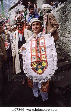 Pakistan, Northern Areas, Hunza Valley, Karimabad, Groom leading at wedding celebration. View Large Photo Image Stock Photograph - Pakistan, Northern Areas, Hunza Valley, Karimabad, Groom leading at wedding celebration.. Fotosearch