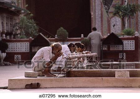 Pakistan, Punjab, Lahore, Wazir Khan Mosque, Men cleansing themselves before prayers. View Large Photo Image Stock Photography - Pakistan, Punjab, Lahore, Wazir Khan Mosque, Men cleansing themselves before prayers.. Fotosearch