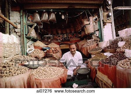 Stock Photograph - Pakistan, Punjab, Multan, Shop selling nuts.. Fotosearch