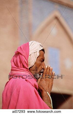 Stock Image - Pakistan, Punjab, Multan, Shrine of Baha-Ud-Din Zakaria, Man praying.. Fotosearch