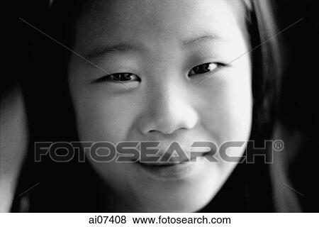 Stock Photo - Portrait of young girl, smiling. Fotosearch
