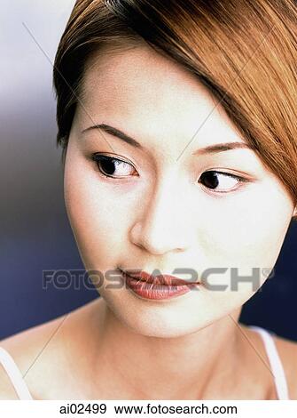 Portrait of young woman, looking away View Large Photo Image Stock Photo - Portrait of young woman, looking away. Fotosearch