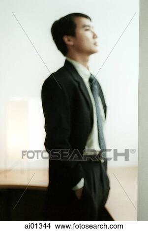 Profile of male executive standing View Large Photo Image Picture - Profile of male executive standing. Fotosearch