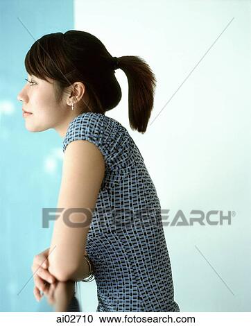 Profile of woman leaning on rail, looking off camera. View Large Photo Image Stock Image - Profile of woman leaning on rail, looking off camera.. Fotosearch