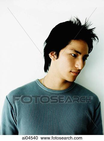 Stock Image - Profile of young man, white background.. Fotosearch