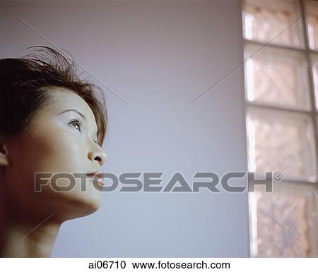 Profile of young woman looking up. View Large Photo Image Stock Image - Profile of young woman looking up.. Fotosearch