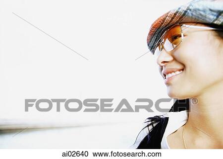 Profile of young woman with patterned hat and sunglasses, white background View Large Photo Image Stock Image - Profile of young woman with patterned hat and sunglasses, white background. Fotosearch
