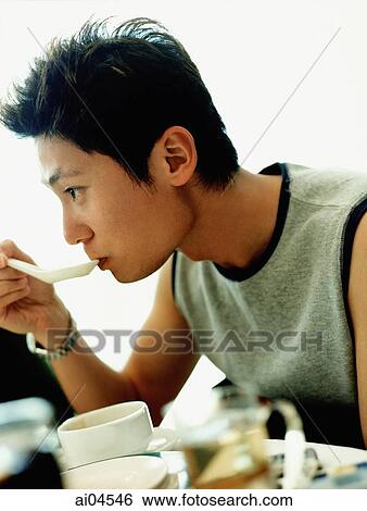Side profile of young man drinking soup. View Large Photo Image Stock Photograph - Side profile of young man drinking soup.. Fotosearch