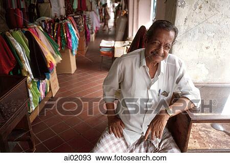 Singapore, Arab Street, Muslim man sit along aisle. View Large Photo Image Stock Image - Singapore, Arab Street, Muslim man sit along aisle.. Fotosearch