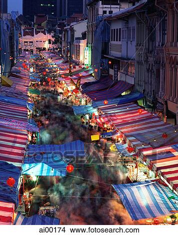 Picture - Singapore, Chinatown, view of street market at dusk. Fotosearch
