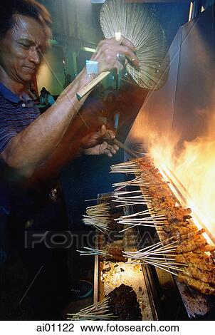 Singapore, Clarke Quay, Man cooking Satay View Large Photo Image Stock Image - Singapore, Clarke Quay, Man cooking Satay. Fotosearch