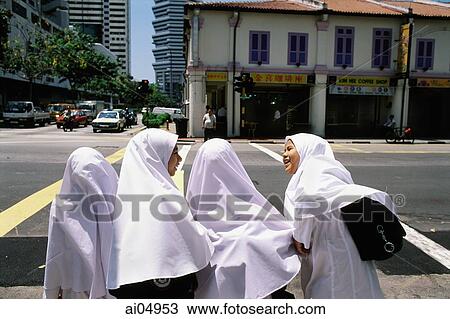 Singapore, students wait for a bus after finishing classes at Madrasah Alsagoff Al-Arabiyah (school). View Large Photo Image Stock Image - Singapore, students wait for a bus after finishing classes at Madrasah Alsagoff Al-Arabiyah (school).. Fotosearch