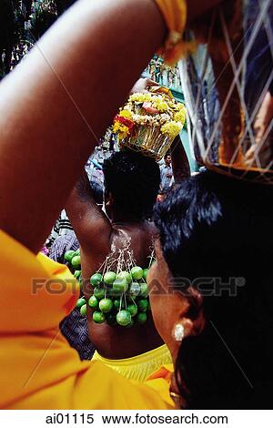 Stock Photography - Singapore, Thaipusam Festival, Hindu Devotee with body piercings.. Fotosearch