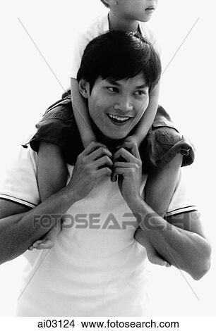 Son on father's shoulders View Large Photo Image Picture - Son on father's shoulders. Fotosearch