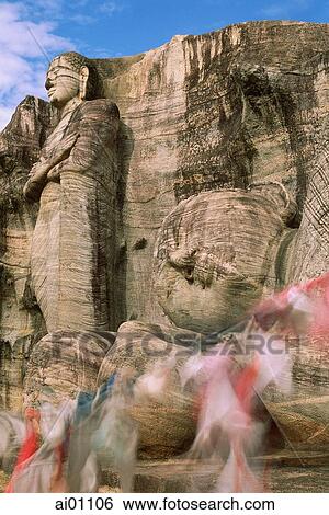 Sri Lanka, Polonnaruwa, Gal - Vihara reclining Buddha and prayer flags View Large Photo Image Stock Photograph - Sri Lanka, Polonnaruwa, Gal - Vihara reclining Buddha and prayer flags. Fotosearch