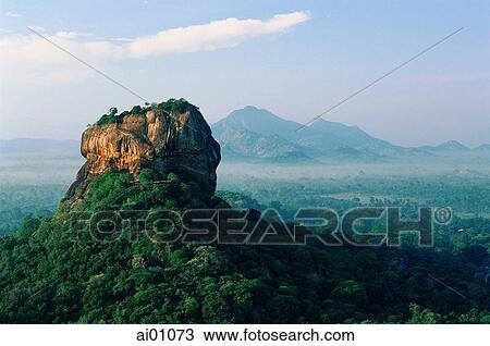 Stock Image - Sri Lanka, Sigiriya Lion Rock Fortress at dawn. Fotosearch