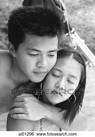 Teenage couple embracing View Large Photo Image Stock Photograph - Teenage couple embracing. Fotosearch