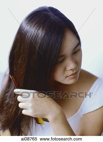 Teenage girl combing hair. View Large Photo Image Stock Photography - Teenage girl combing hair.. Fotosearch