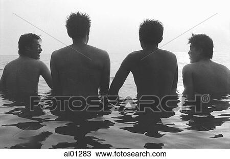 Teenagers wading in ocean, rear view, silhouette View Large Photo Image Stock Image - Teenagers wading in ocean, rear view, silhouette. Fotosearch
