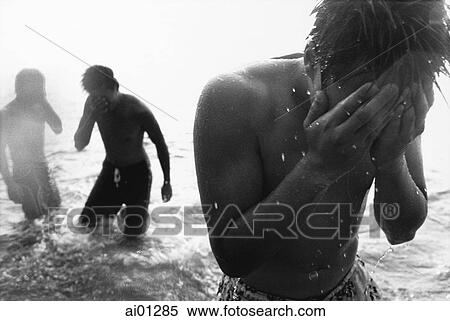 Teenagers wading in the ocean View Large Photo Image Stock Photography - Teenagers wading in the ocean. Fotosearch