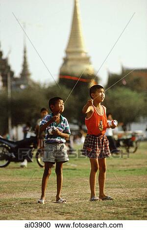 Thailand, Bangkok, Grand Palace, Sanam Luang Field, Family Kite Flying Day View Large Photo Image Stock Image - Thailand, Bangkok, Grand Palace, Sanam Luang Field, Family Kite Flying Day. Fotosearch