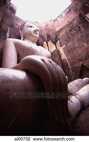 Stock Image - Thailand, Sukothai, Giant statue of Buddha. Fotosearch