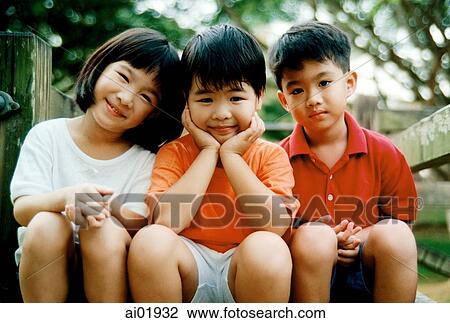Three children sitting together View Large Photo Image Stock Image - Three children sitting together. Fotosearch