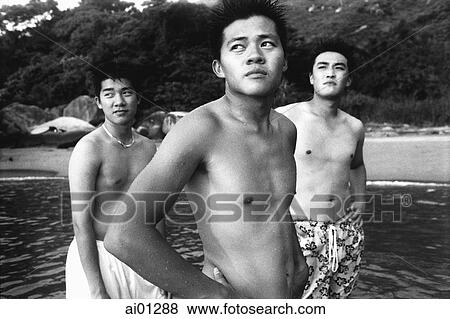 Three teenagers at beach View Large Photo Image Stock Photo - Three teenagers at beach. Fotosearch