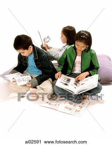 Three young children (two girls, one boy) reading books, white background. View Large Photo Image Stock Image - Three young children (two girls, one boy) reading books, white background.. Fotosearch