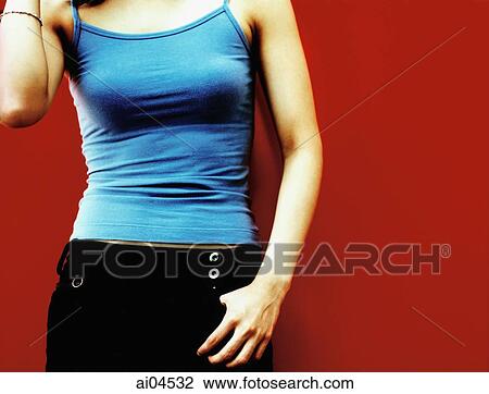 Torso of woman with thumb in pocket, red background. View Large Photo Image Stock Image - Torso of woman with thumb in pocket, red background.. Fotosearch