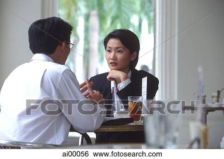 Two executives talking in cafe View Large Photo Image Stock Photograph - Two executives talking in cafe. Fotosearch