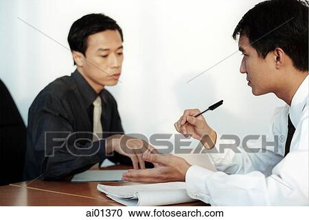 Two male executives meeting. View Large Photo Image Stock Image - Two male executives meeting.. Fotosearch