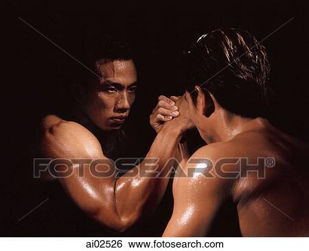 Two men arm wrestling, black background View Large Photo Image Stock Photograph - Two men arm wrestling, black background. Fotosearch