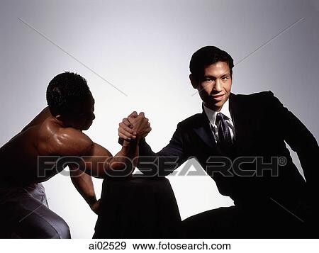 Two men arm wrestling, white background View Large Photo Image Stock Photo - Two men arm wrestling, white background. Fotosearch