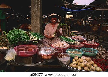 Vietnam, Ben Thanh market, Ho Chi Minh city, Woman selling fruit and vegetables at market stall. View Large Photo Image Stock Photo - Vietnam, Ben Thanh market, Ho Chi Minh city, Woman selling fruit and vegetables at market stall.. Fotosearch