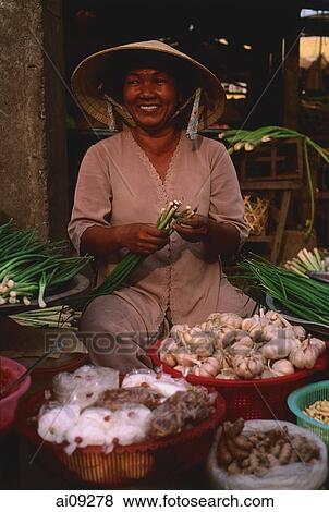 Vietnam, Ben Thanh market, Ho Chi Minh city, Woman selling fruit and vegetables at market stall. View Large Photo Image Stock Photo - Vietnam, Ben Thanh market, Ho Chi Minh city, Woman selling fruit and vegetables at market stall.. Fotosearch