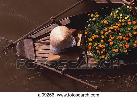 Stock Photograph - Vietnam, Can Tho, Hau river, Flower seller - floating market.. Fotosearch
