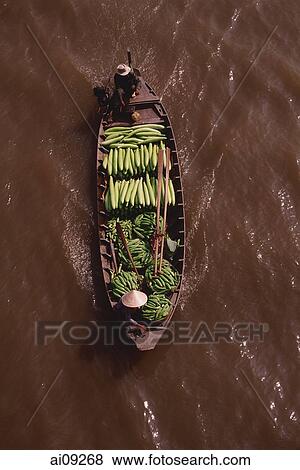 Vietnam, Can Tho, Hau river, Vegetable sellers passing under bridge, floating market. View Large Photo Image Stock Photo - Vietnam, Can Tho, Hau river, Vegetable sellers passing under bridge, floating market.. Fotosearch