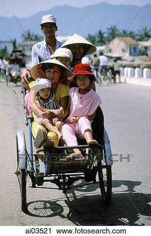 Vietnam, Central, Family riding in cyclo View Large Photo Image Stock Image - Vietnam, Central, Family riding in cyclo. Fotosearch