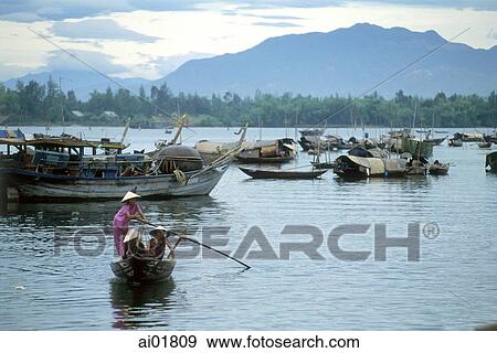 Vietnam, Danang, woman rowing sampan at Thu Bon River. View Large Photo Image Stock Photo - Vietnam, Danang, woman rowing sampan at Thu Bon River.. Fotosearch