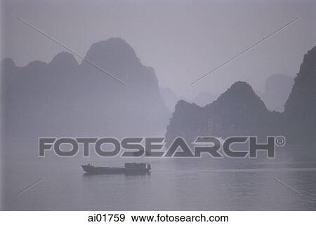 Vietnam, Halong Bay, boat in the mist. View Large Photo Image Stock Photo - Vietnam, Halong Bay, boat in the mist.. Fotosearch
