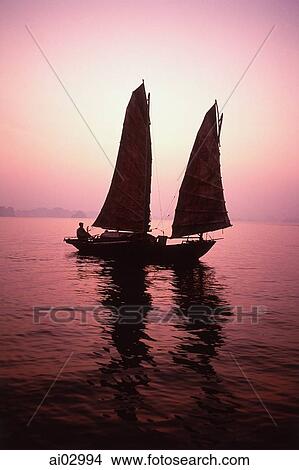 Vietnam, Halong Bay, Fishing junk at dawn View Large Photo Image Picture - Vietnam, Halong Bay, Fishing junk at dawn. Fotosearch